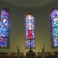 Glass windows above the head altar